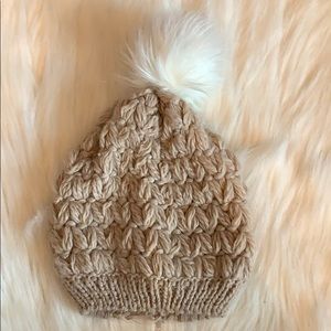 cream beanie with puff on top